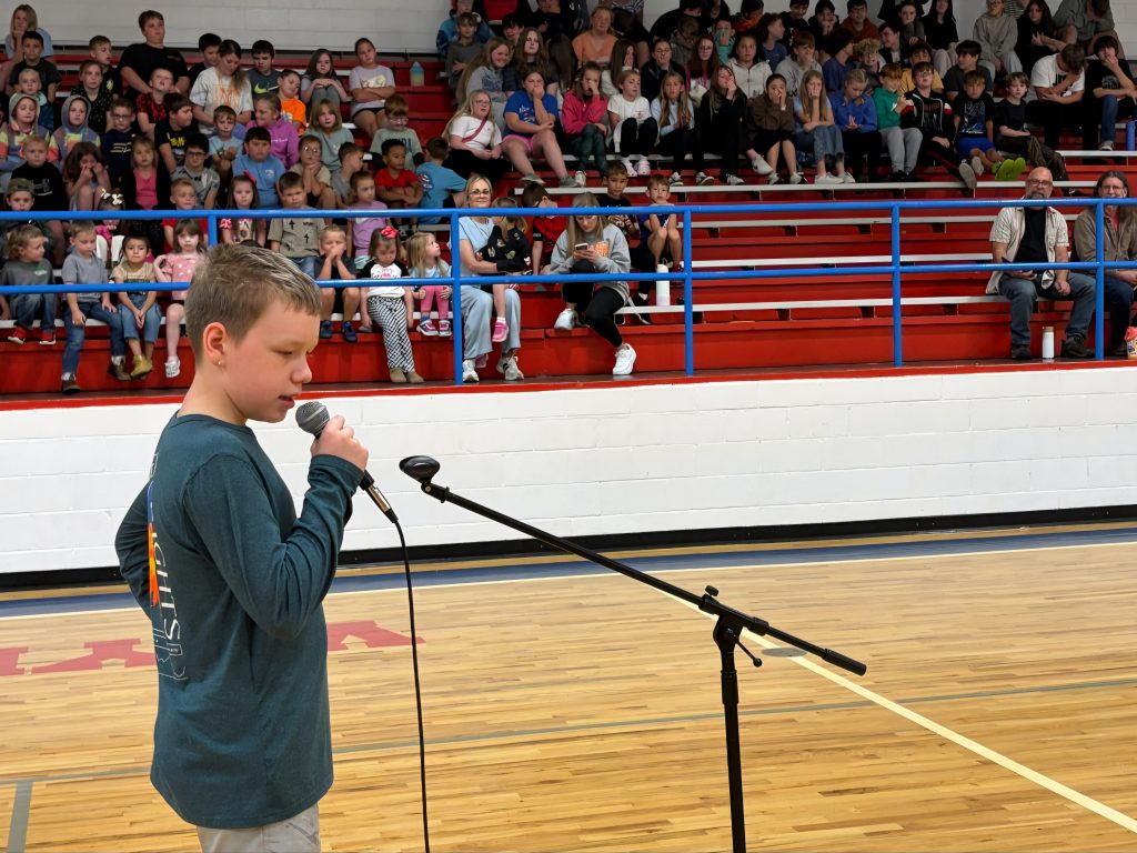 A Wynn Bulldog steps up to the mic during the performance.
